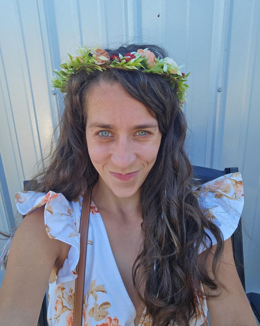 Lara Jackson, founder of Aligned-AI, smiling in a flower crown